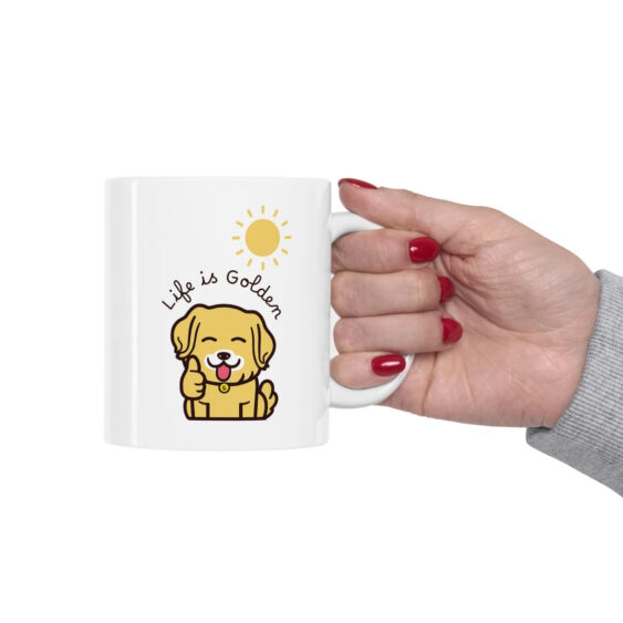 Hand holding Life is golden coffee mug